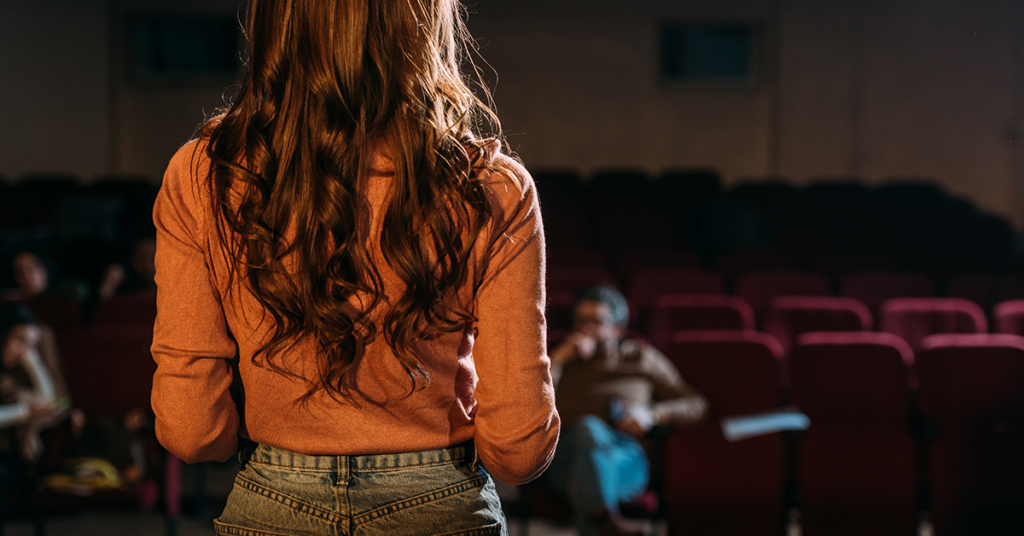 Person auditioning for theatre program